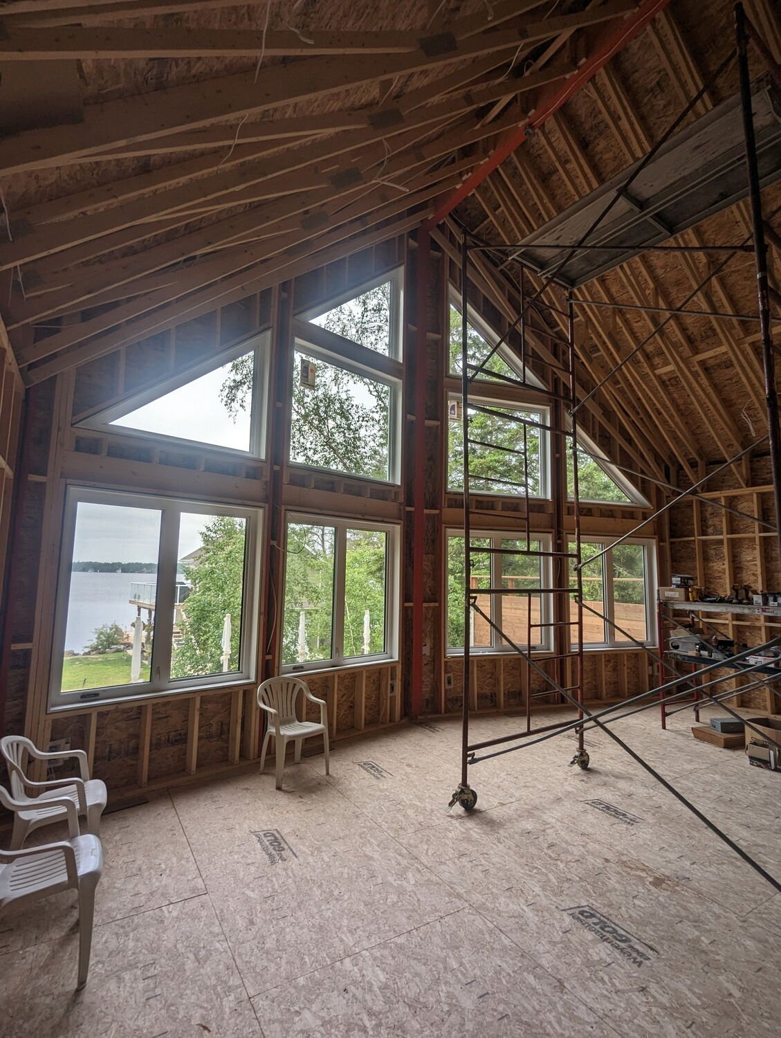 Timber-frame custom interior with full-height windows.