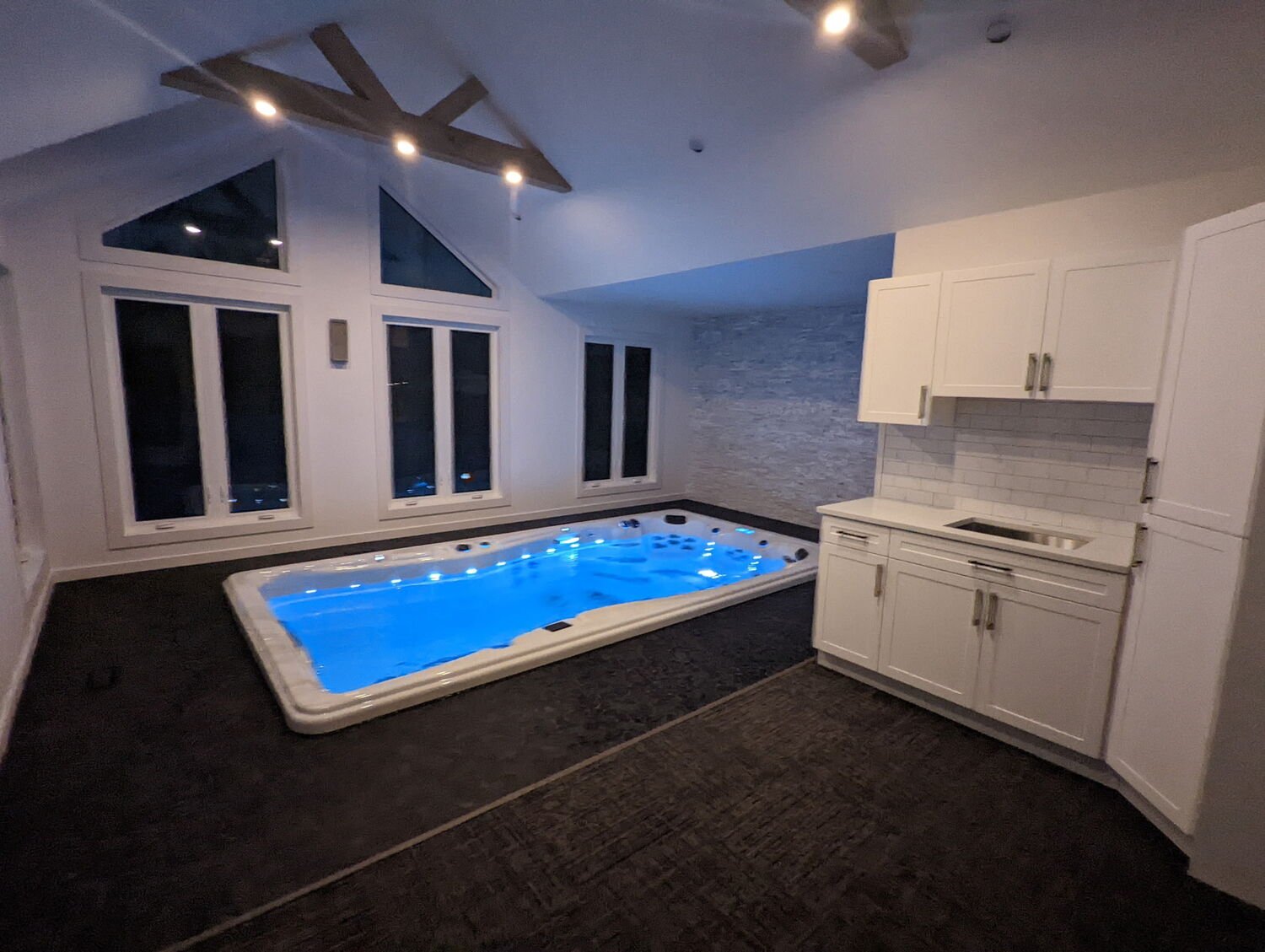 Finished custom great room with indoor pool.